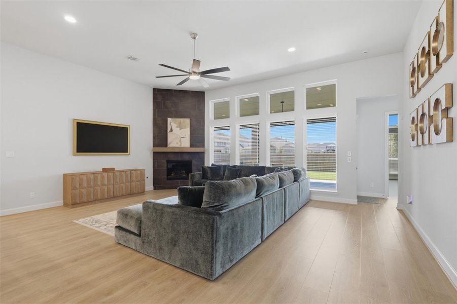 Modern accent wall and gas fireplace create apolished focal point in the living room. Modern accent wall and gas fireplace create apolished focal point in the living room.