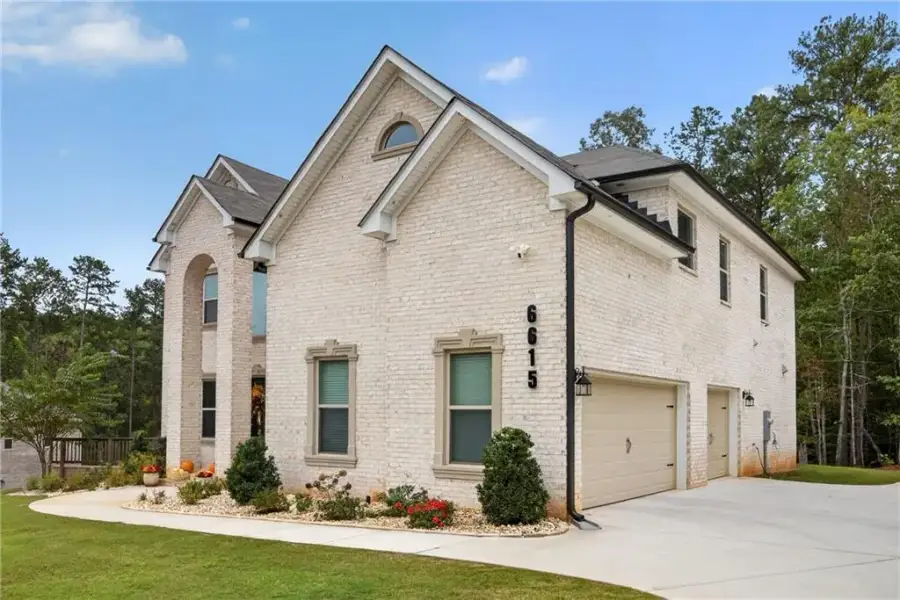 Front exterior of a new home in , Douglasville, GA, highlighting curb appeal (Image 23).
