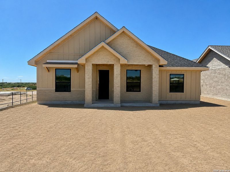 Front exterior of a new home in , Eagle Pass, TX, highlighting curb appeal (Image 8). Front exterior of a new home in , Eagle Pass, TX, highlighting curb appeal (Image 8).