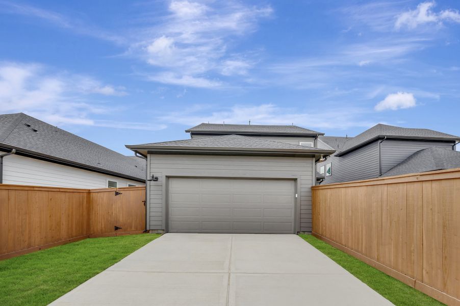 Front exterior of a new home in Elyson - Grove Row Collection, Katy, TX, highlighting curb appeal (Image 23).