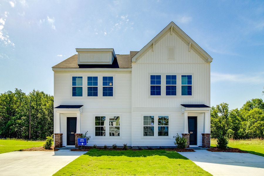 Front exterior of a new home in Padgett Commons, Hopkins, SC, highlighting curb appeal (Image 2). Front exterior of a new home in Padgett Commons, Hopkins, SC, highlighting curb appeal (Image 2).