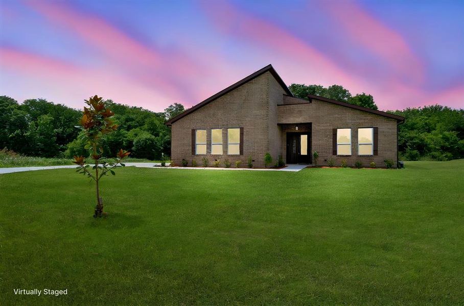Contemporary brick exterior with a dark-toned roofline Contemporary brick exterior with a dark-toned roofline