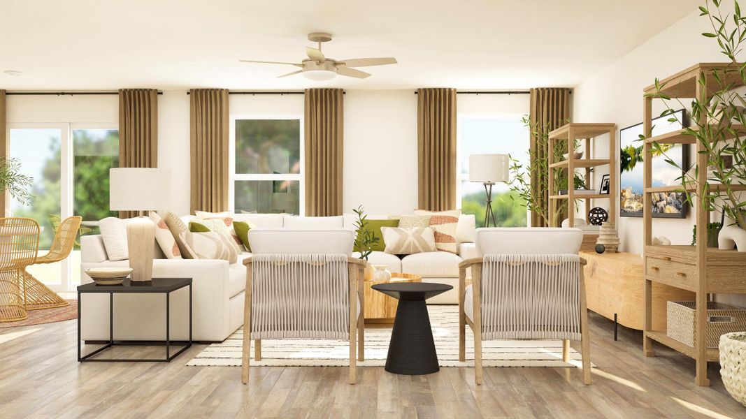 A living room with a white couch and a table.