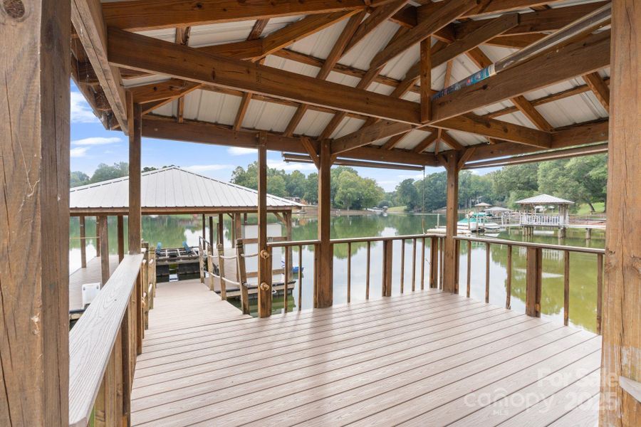 New floating dock with covered sitting area and boat lift New floating dock with covered sitting area and boat lift