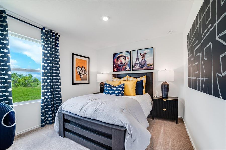 Carpeted bedroom with baseboards Carpeted bedroom with baseboards