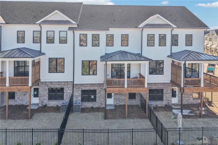 Exterior details and patio area of a home in Millcroft Townhomes, Buford (Image 28). Exterior details and patio area of a home in Millcroft Townhomes, Buford (Image 28).