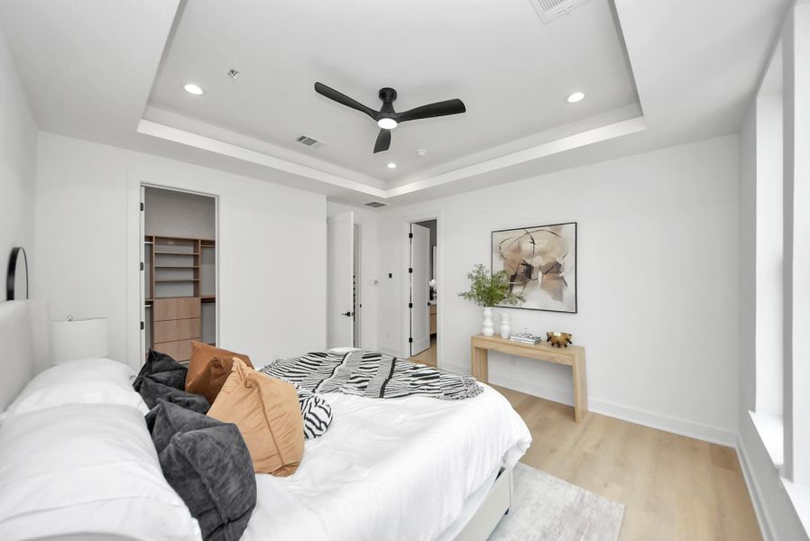 Primary bedroom with convenient access to the walk-in closet and ensuite bathroom.