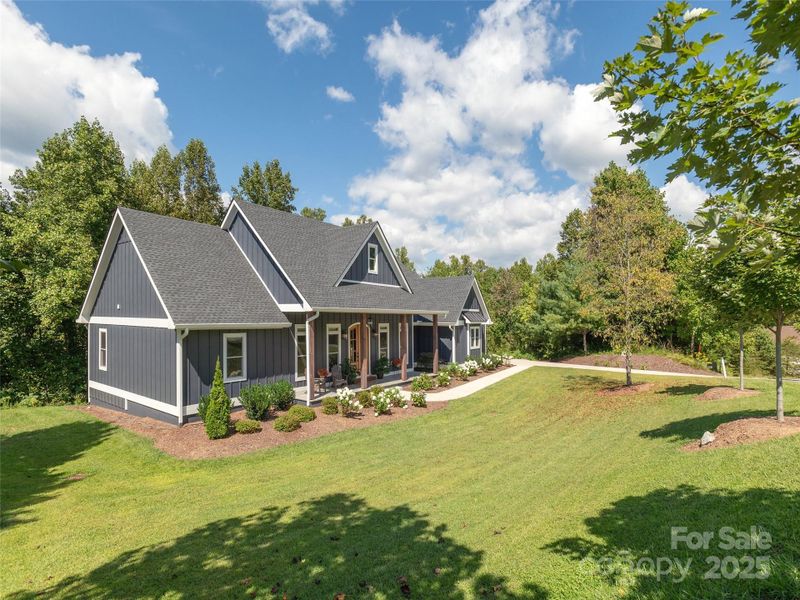 Front exterior of a new home in , Hendersonville, NC, highlighting curb appeal (Image 21).