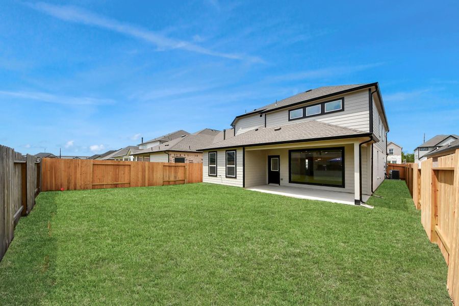 Experience outdoor living at its finest on this expansive covered patio, thoughtfully designed for BBQs and delightful outdoor dining. Sample photo of completed home with similar floor plan. Actual colors and selections may vary. Experience outdoor living at its finest on this expansive covered patio, thoughtfully designed for BBQs and delightful outdoor dining. Sample photo of completed home with similar floor plan. Actual colors and selections may vary.
