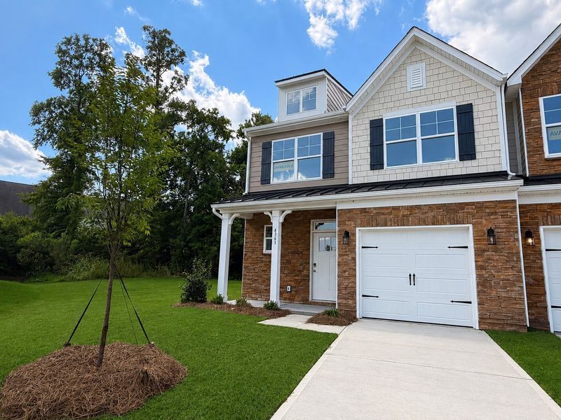 Front exterior of a new home in Harrisburg Village Townhomes, Harrisburg, NC, highlighting curb appeal (Image 1). Front exterior of a new home in Harrisburg Village Townhomes, Harrisburg, NC, highlighting curb appeal (Image 1).