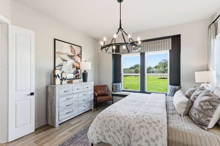 Representative furnished interior of a home built from the Pegasus by Chesmar Homes in Centero at Stone Oak, San Antonio (Image 8).
