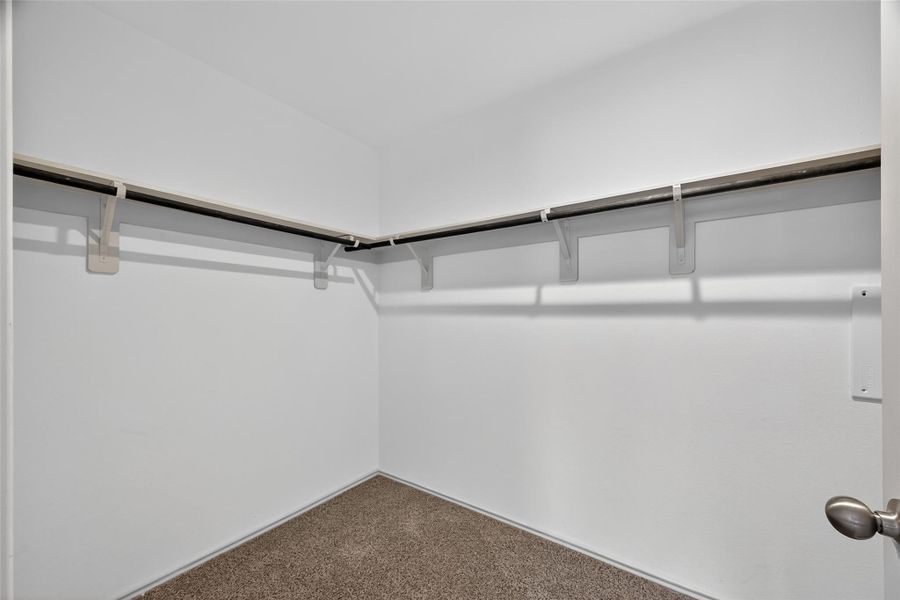 A generously sized primary closet with plenty of room for clothing, shoes, and accessories. It’s one of the most appreciated features of the primary suite. A generously sized primary closet with plenty of room for clothing, shoes, and accessories. It’s one of the most appreciated features of the primary suite.
