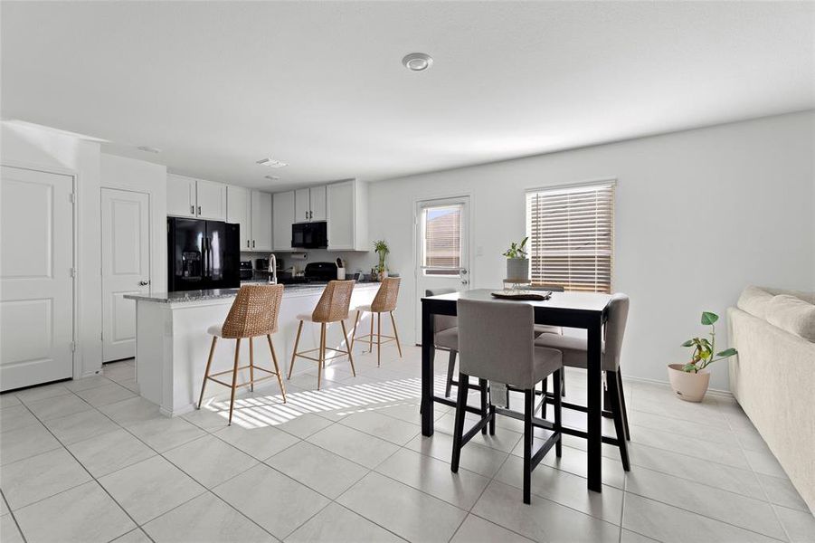Dining room with light tile patterned floors