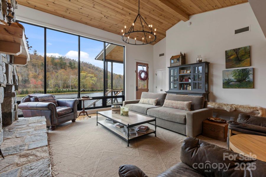 Floor to Ceiling Fireplace and Wall to Wall Windows makes this Space Shine