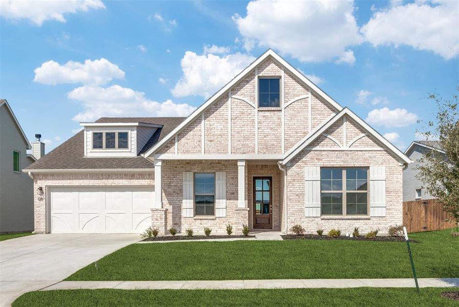 Craftsman-style home with a garage and a front lawn