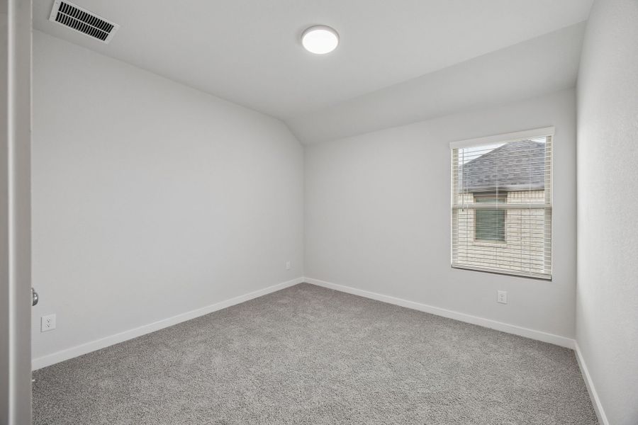 Bedroom in the Masters home plan by Trophy Signature Homes – REPRESENTATIVE PHOTO