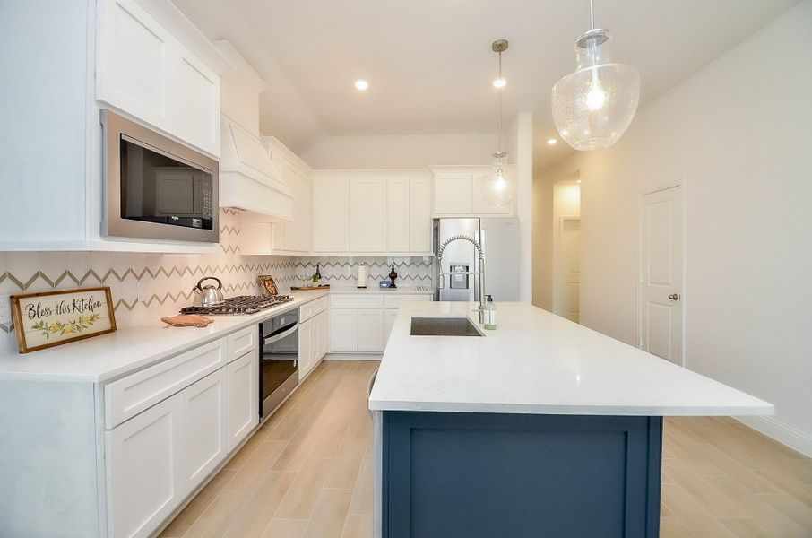 Modern kitchen featuring ample counter space, perfect for cooking and entertaining.