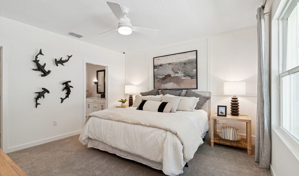 Primary suite with decorated feature wall