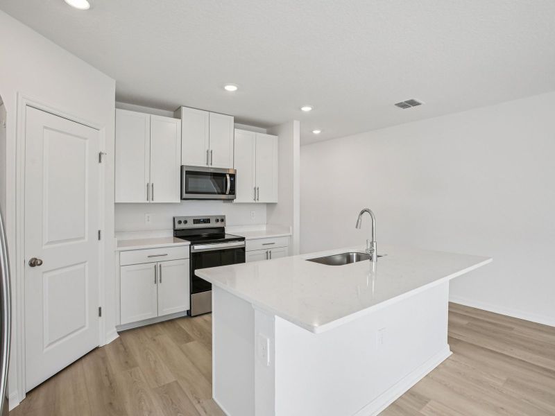 Furnished interior view inside a new home in Two Rivers - Classic Series, Zephyrhills (Image 4).