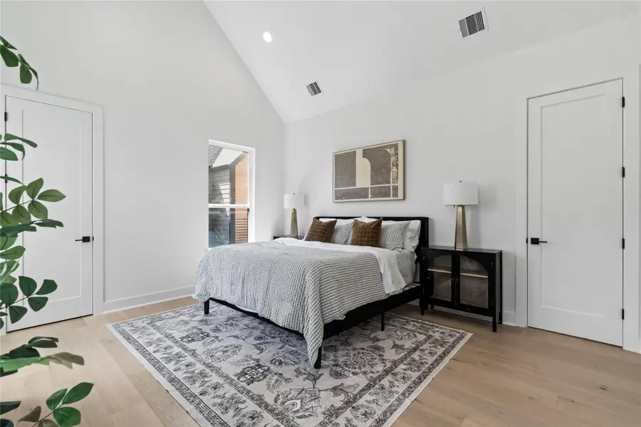 Serene and beautifully scaled, the third-floor primary suite unfolds beneath a cathedral ceiling that elevates both light and volume. Wide-plank engineered oak floors ground the space, while solid-core doors and thoughtful separation lead to a resort-style bath and custom-shelved wardrobe. A hush of calm, engineered for restorative nights and unhurried mornings. Serene and beautifully scaled, the third-floor primary suite unfolds beneath a cathedral ceiling that elevates both light and volume. Wide-plank engineered oak floors ground the space, while solid-core doors and thoughtful separation lead to a resort-style bath and custom-shelved wardrobe. A hush of calm, engineered for restorative nights and unhurried mornings.