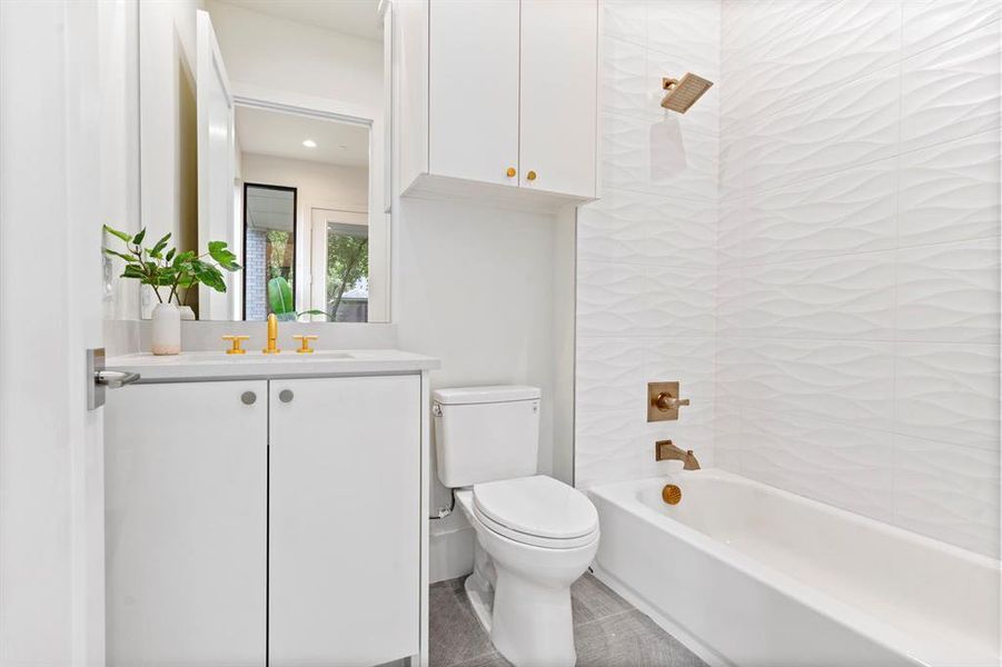 Full bathroom with vanity and bathing tub / shower combination Full bathroom with vanity and bathing tub / shower combination