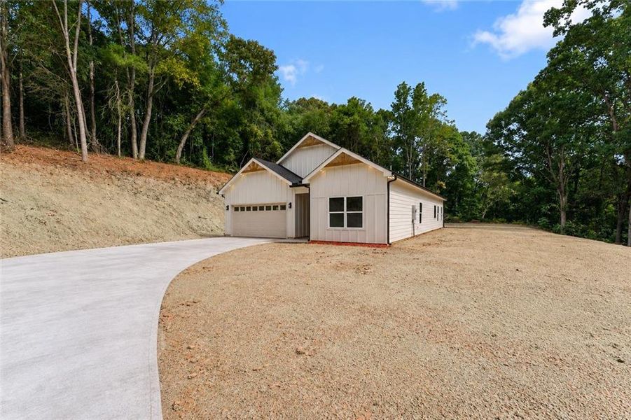 Front exterior of a new home in , Gainesville, GA, highlighting curb appeal (Image 25).