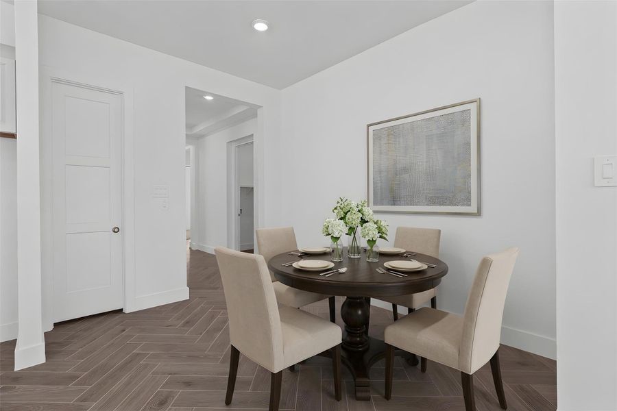 Create lasting memories around the table with family and friends in the breakfast nook! It showcases high ceilings, recessed lighting, and gorgeous tile flooring for a warm and welcoming atmosphere. *Virtually Staged