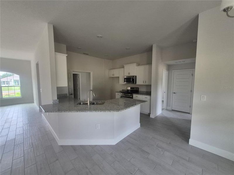Furnished interior view inside a new home in Hill Country Estates, Dade City (Image 10).