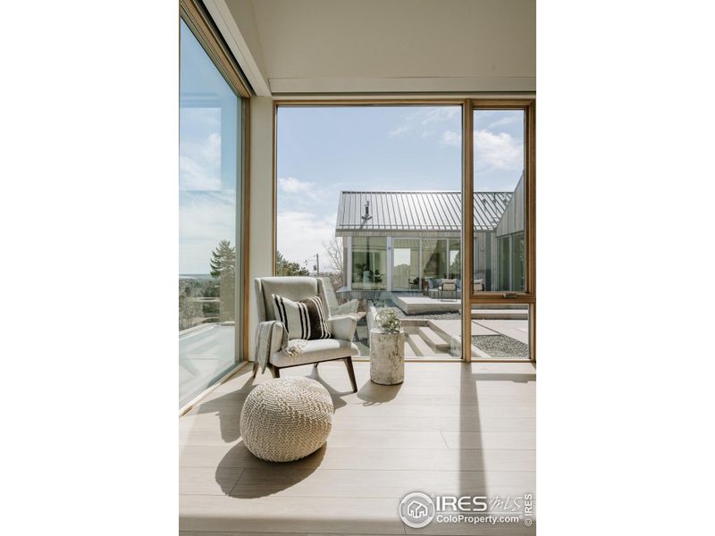 Primary bedroom overlooking patio / pool / spa