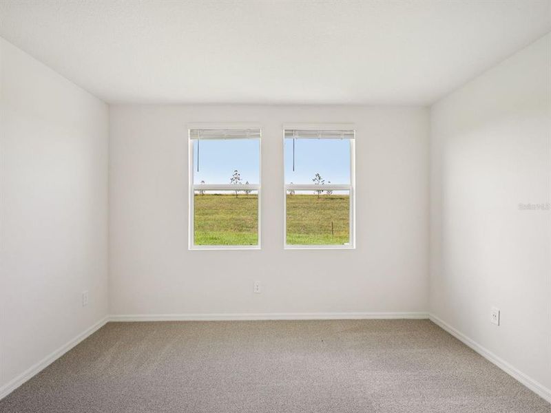 Spacious, unfurnished interior of a new home in The Reserve at Van Oaks, Auburndale (Image 23).