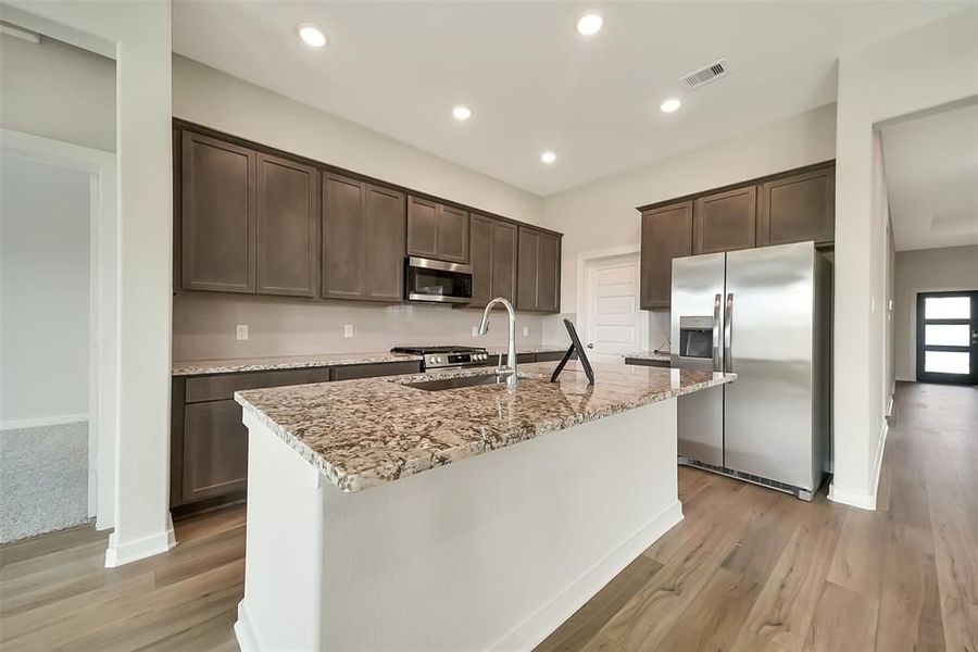 Furnished interior view inside a new home in Sunterra, Katy (Image 24).
