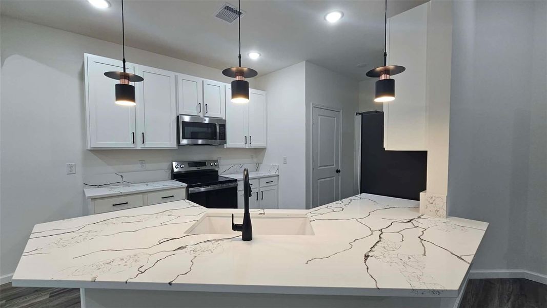 Furnished interior view inside a new home in , Kenefick (Image 10).