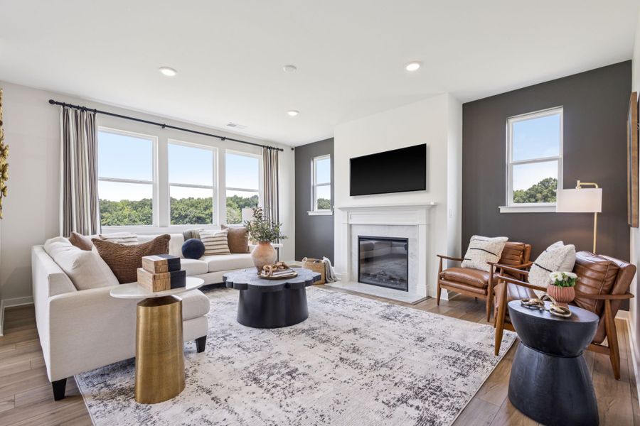 A living room with a fireplace. A living room with a fireplace.