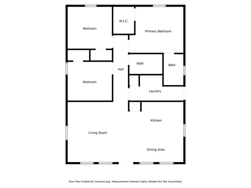 This charming home features a modern, white exterior with a welcoming front porch making it a cozy retreat.