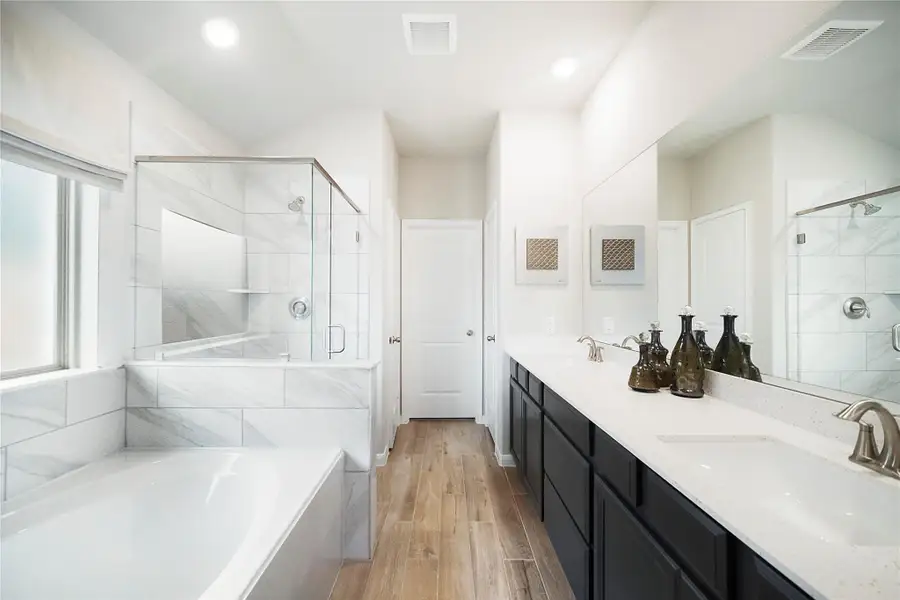 Furnished interior view inside a new home in Sunterra: Premier Collection, Katy (Image 9). Furnished interior view inside a new home in Sunterra: Premier Collection, Katy (Image 9).