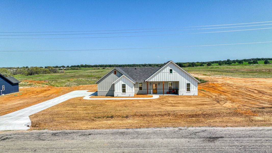 Representative exterior photo of a completed home built from the Loretta by Zeal Home Builders in Patti Lynn Hills, Paradise, TX (Image 28). Representative exterior photo of a completed home built from the Loretta by Zeal Home Builders in Patti Lynn Hills, Paradise, TX (Image 28).