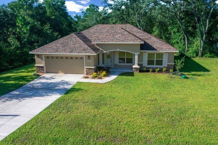 Front exterior of a new home in , Dunnellon, FL, highlighting curb appeal (Image 22).