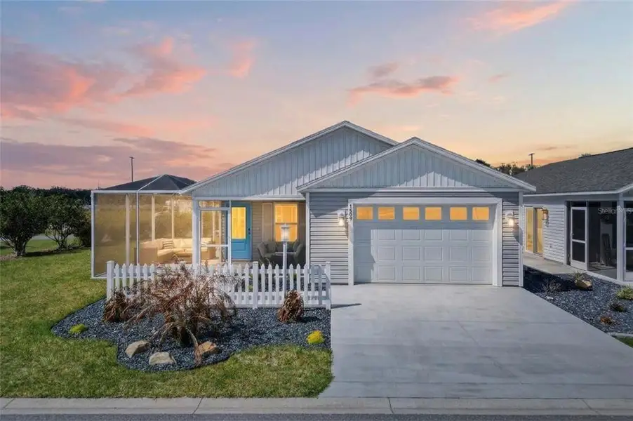 Front exterior of a new home in , The Villages, FL, highlighting curb appeal (Image 26). Front exterior of a new home in , The Villages, FL, highlighting curb appeal (Image 26).
