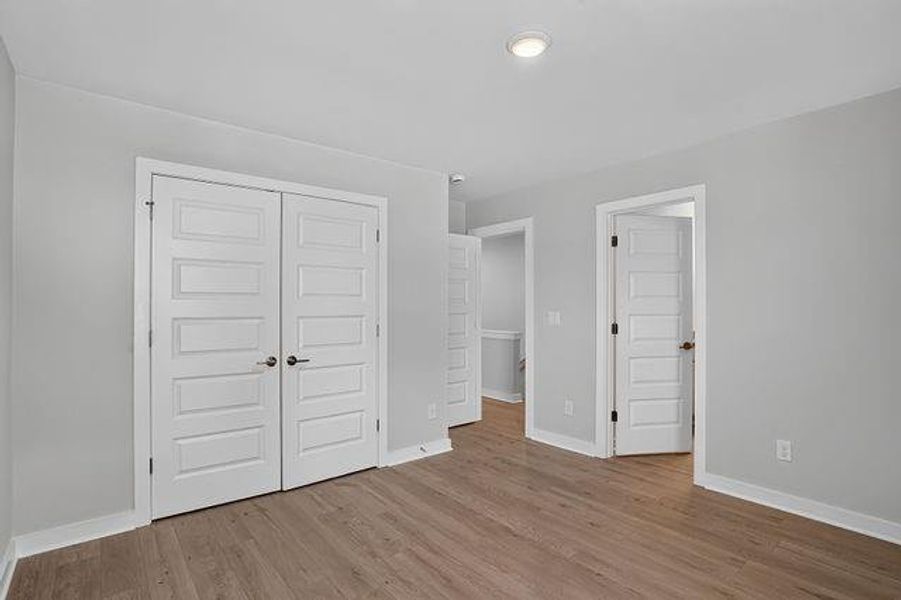 Spacious, unfurnished interior of a new home in The Cottages at East Lanier, Fayetteville (Image 10).