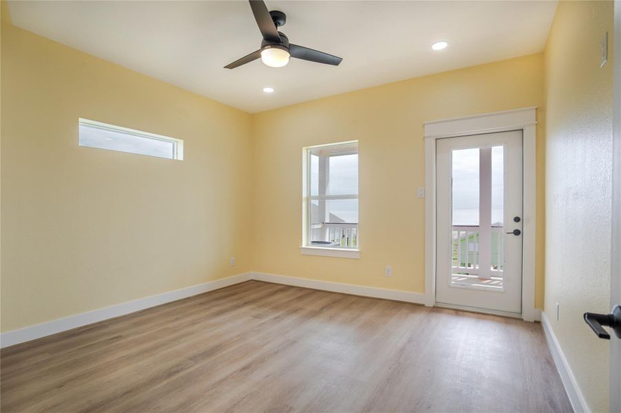 Enjoy the views from this bedroom. Lots of natural light and an outdoor deck for morning coffee or sunset cocktails!