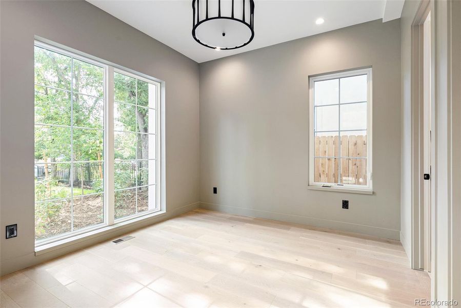 Main-floor guest room with en suite 3/4 bath or use as a 2nd office