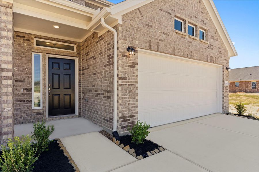Closer look at the inviting covered front porch and entryway. This welcoming entrance provides the perfect space to greet guests while enjoying the charm and architectural detail of this beautiful CastleRock home.