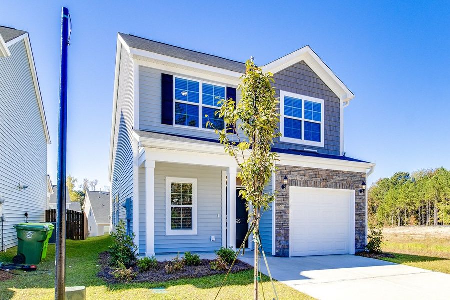 Front exterior of a new home in The Falls, Blythewood, SC, highlighting curb appeal (Image 20).