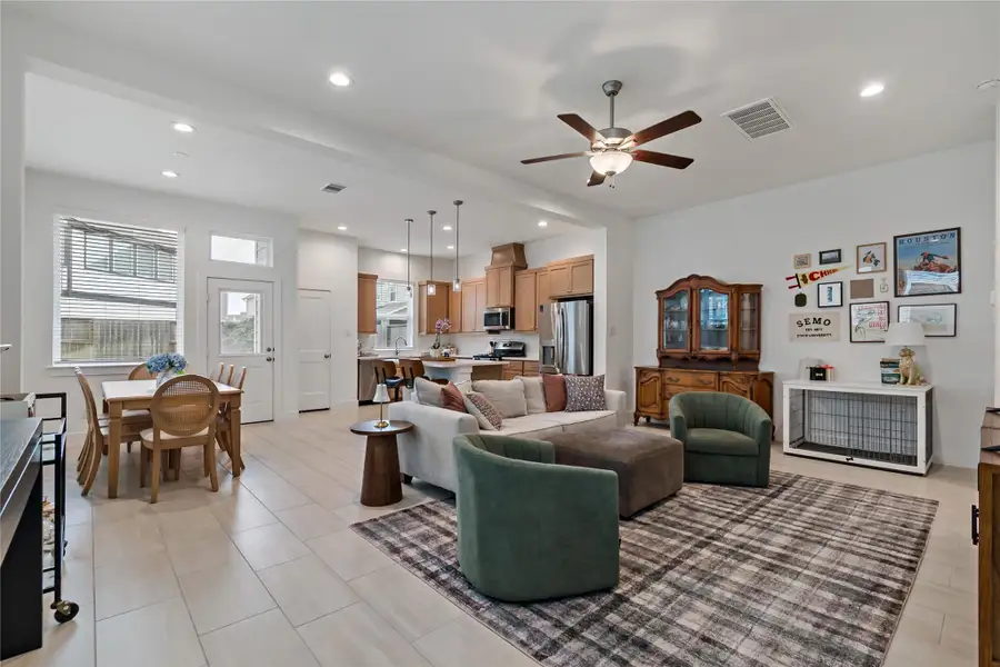 Spacious open-concept living area with modern kitchen, cozy seating, and abundant natural light. Perfect for entertaining and family gatherings. Spacious open-concept living area with modern kitchen, cozy seating, and abundant natural light. Perfect for entertaining and family gatherings.
