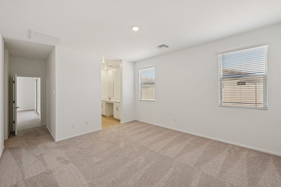 Primary suite. Finishes and options may vary by community