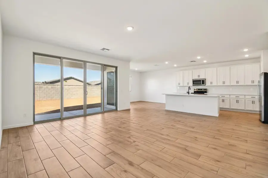 Great room, kitchen and dining. Not actual home, finishes and options may vary. Great room, kitchen and dining. Not actual home, finishes and options may vary.