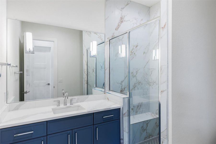 Bathroom 5 en-suite with vanity and a marble finish shower Bathroom 5 en-suite with vanity and a marble finish shower