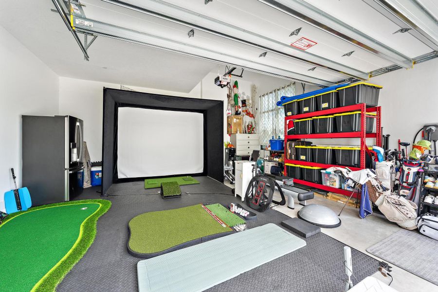 Golf simulator in one of the two garages.