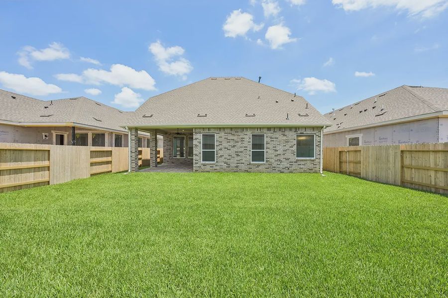 Exterior details and patio area of a home in Wood Leaf Reserve, Tomball (Image 25). Exterior details and patio area of a home in Wood Leaf Reserve, Tomball (Image 25).