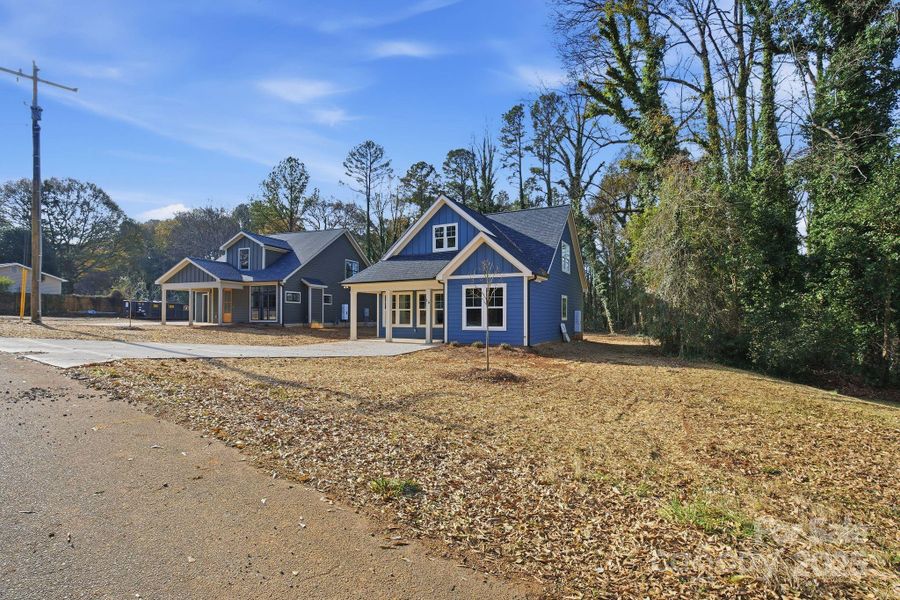 Front exterior of a new home in , Belmont, NC, highlighting curb appeal (Image 17).